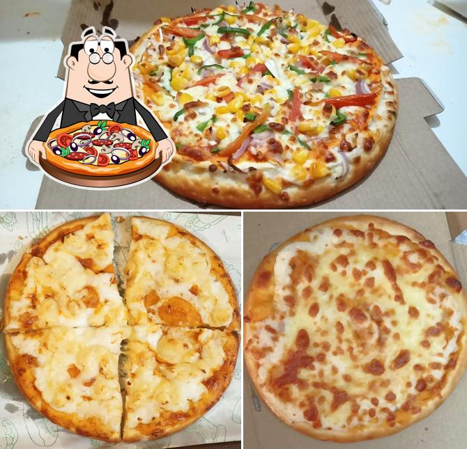 Try out pizza at The Yummy Pizza