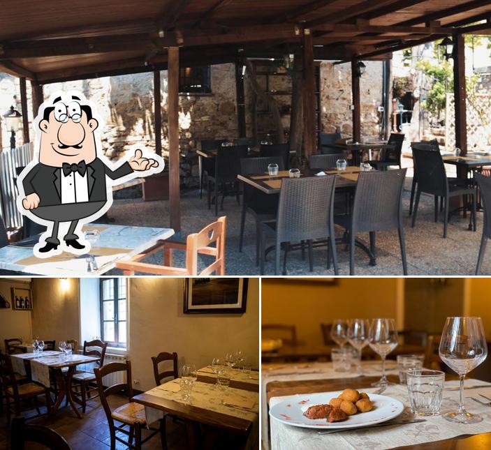 La foto della interni e tavolo da pranzo di Osteria C'era una volta