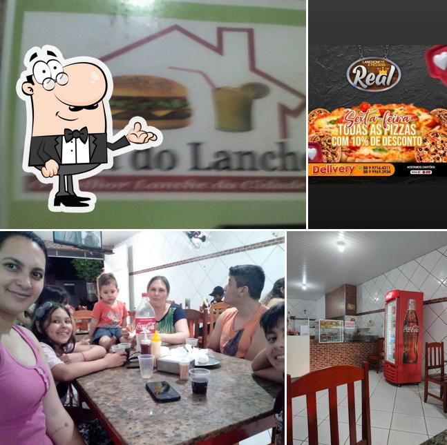 Dê uma olhada a imagem apresentando interior e comida no Lanchonete e Pizzaria Real