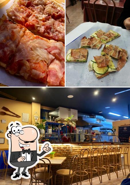 The photo of Restaurante Pizza Alla Pala’s interior and food