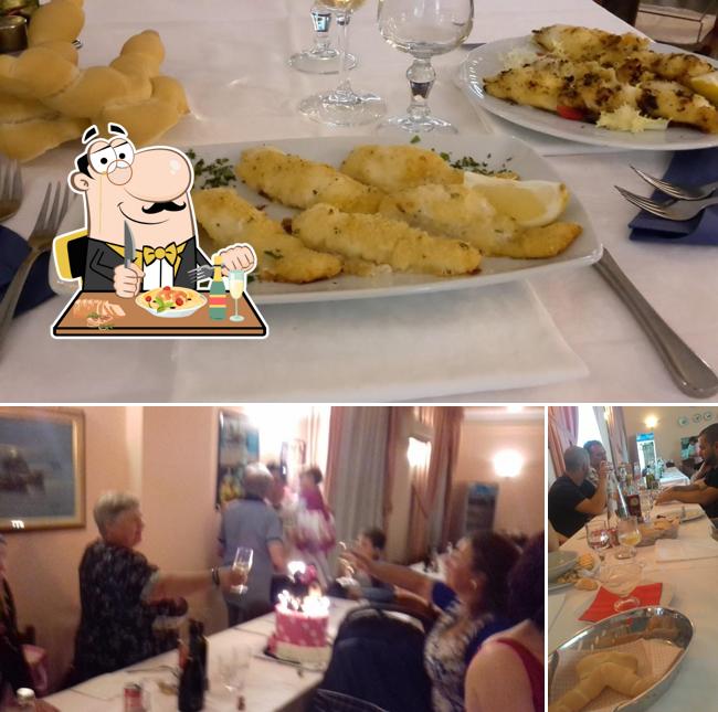 Questa è la foto che presenta la cibo e tavolo da pranzo di Ristorante Pizzeria San Lorenzo