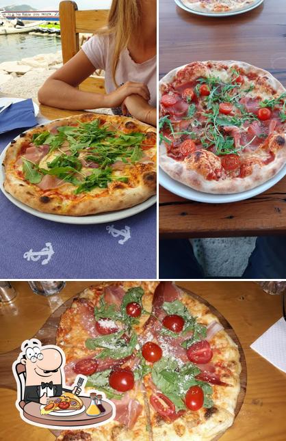 A Konoba Pizzeria Dida Slatine, puoi prenderti una bella pizza