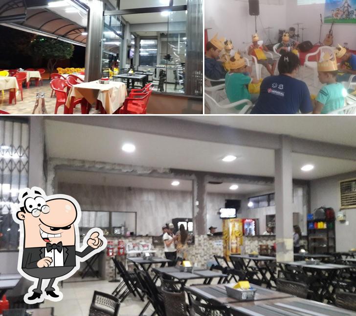 Sente em uma das mesas no D'italia Pizzaria