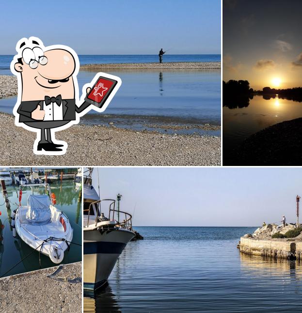 Puoi goderti l'aria fresca da seduto all'esterno di Ristorante Porto Rose