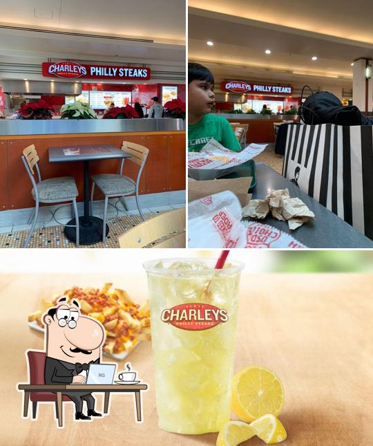Take a look at the photo displaying interior and beverage at Charleys Cheesesteaks