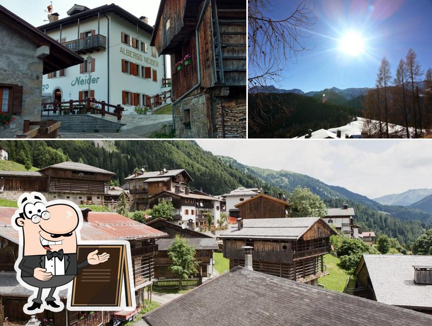 Puoi goderti l'aria fresca da seduto all'esterno di Albergo Neider