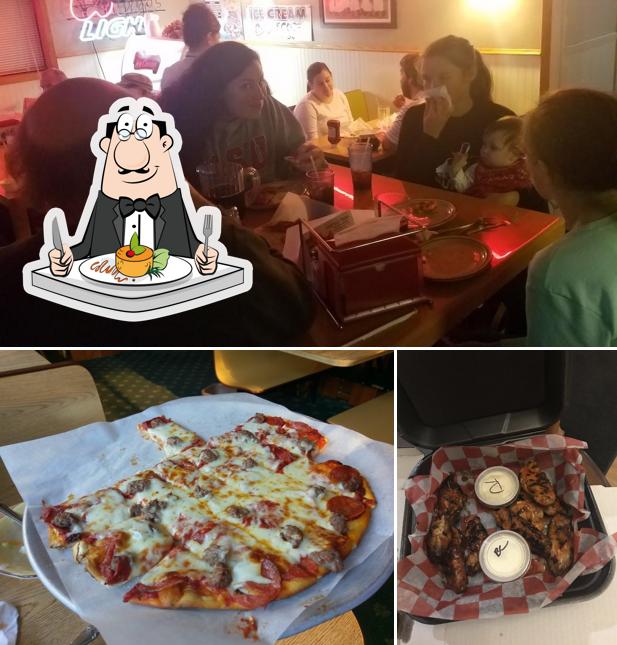 Check out the picture showing food and interior at Charlie's Pizza