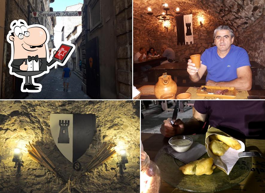 Puoi goderti l'aria fresca da seduto all'esterno di Osteria del Pozzo Terziere Mezule Narni