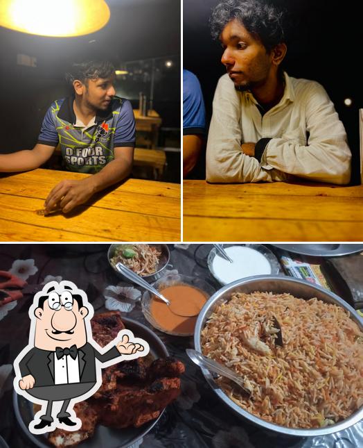 Take a look at the image displaying interior and food at Kadamakudy Nights