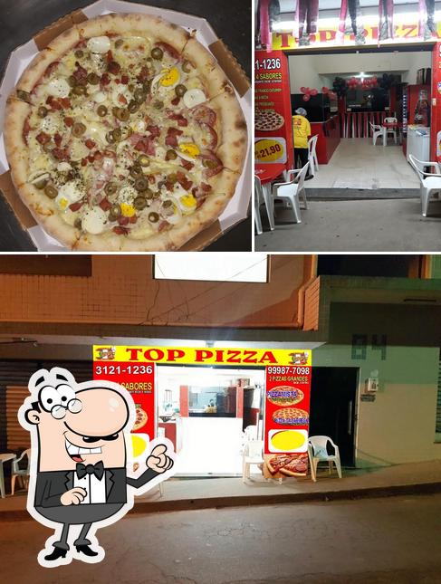 Esta é a foto mostrando interior e pizza no Pizzaria Top Pizza igarapé