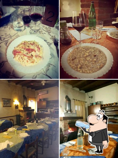 Guarda la foto che mostra la bevanda e interni di Pizzeria Trattoria Grande “La Bora”