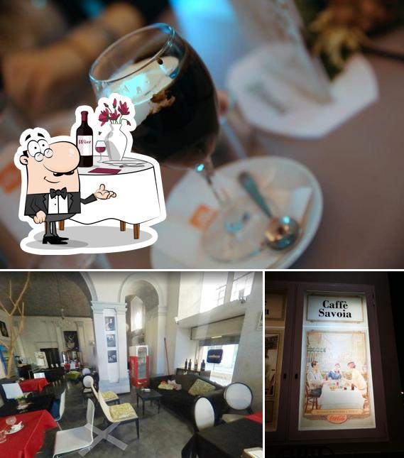 L’image de la table à manger et vin de Caffè Savoia’s
