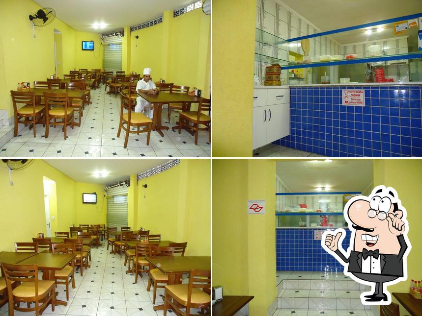 O interior do Pizzaria e Esfiharia Vitor Hugo