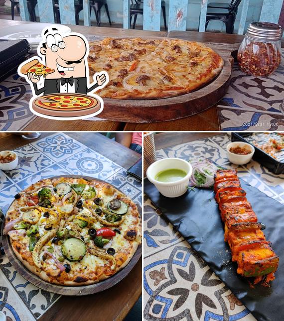 Get pizza at HAVANA - Rooftop Vegetarian Cafe