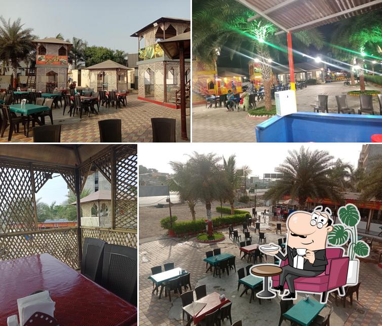 Take a seat at one of the tables at Amdavadi Chicken