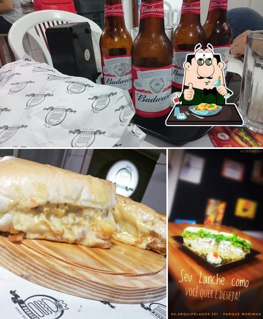 Dê uma olhada a imagem mostrando comida e cerveja no D'Burguer Degani Lanches