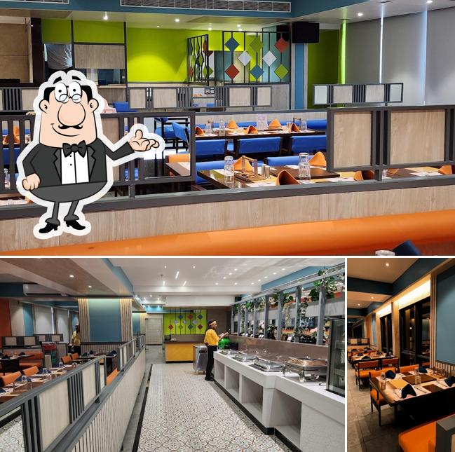 Take a seat at one of the tables at Barbeque Ville - VADODARA Best UNLIMITED Barbecue IN VADODARA