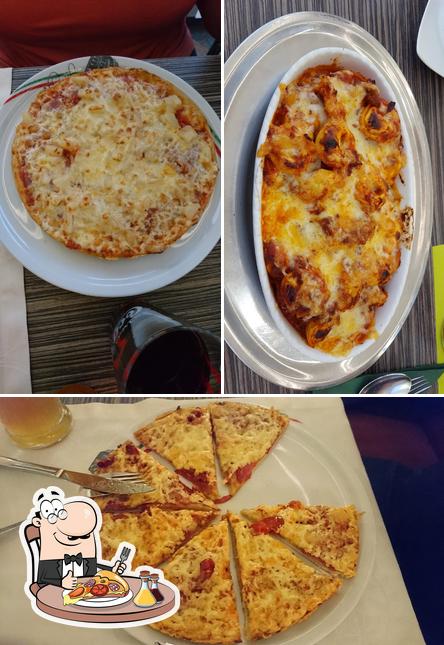 Попробуйте пиццу в "Bella Italia Tommis Pizza"