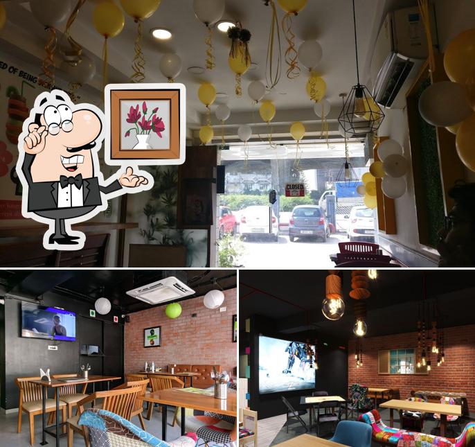 Take a seat at one of the tables at Sam's Alive Again - The Health Cafe
