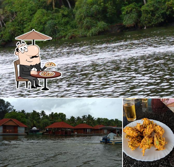 The picture of exterior and food at Stephens Floating Restaurant, Poovar