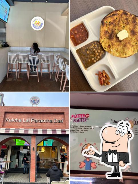 Take a seat at one of the tables at Kulcha Lal Parantha Das