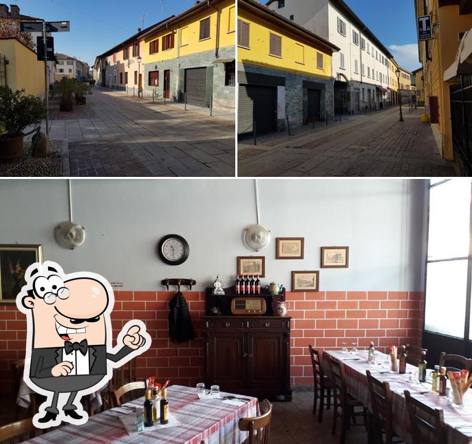 Guarda la immagine che presenta la esterno e tavolo da pranzo di Trattoria della Fontana