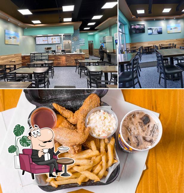 Take a look at the image depicting interior and food at Captain Jay's Fish & Chicken