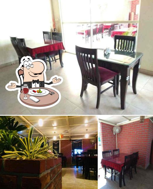 Check out the picture displaying dining table and interior at Tayo Restaurant