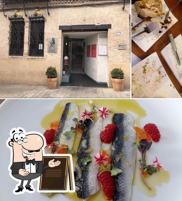 The image of exterior and fish at Bar Restaurante La Tarara