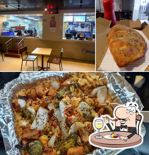 The photo of Domino's Pizza Greater Kailash, Jammu’s food and interior