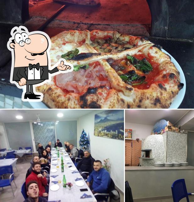 La foto di interni e pizza da Napoli e Pizza