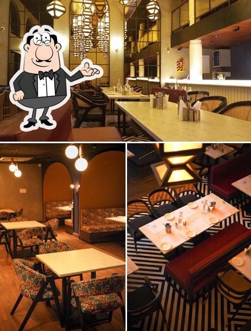 Take a seat at one of the tables at Masala Door - Artisanal Vegetarian