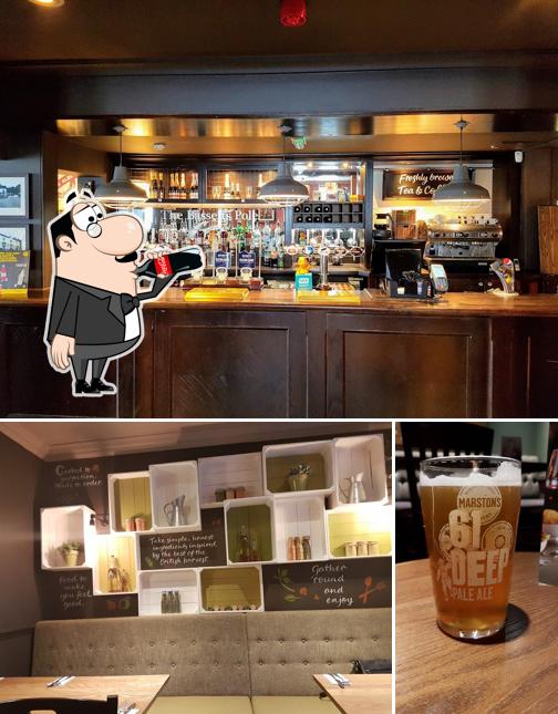 Take a look at the photo showing drink and interior at Harvester Bassetts Pole Sutton Coldfield