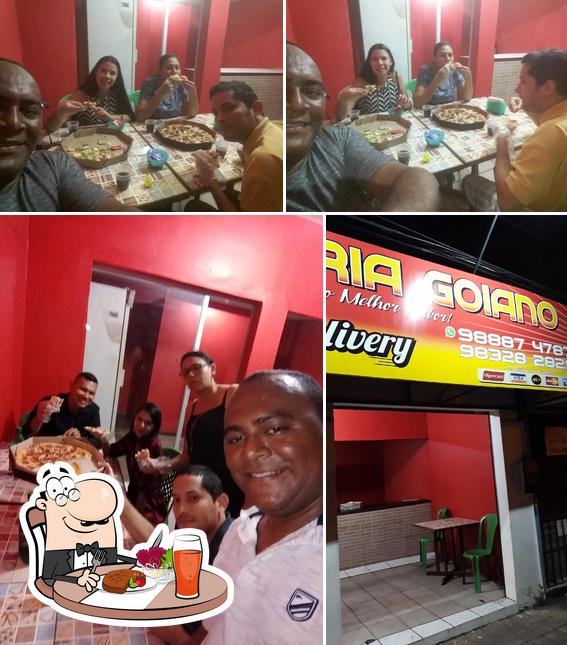 Dê uma olhada a foto mostrando mesa de jantar e interior no Pizzaria Goiano