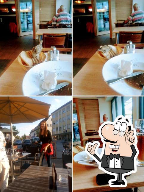 Посмотрите на внутренний интерьер "Café Bar Milos bei Giuseppe"