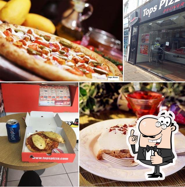 Здесь можно посмотреть изображение пиццерии "Tops Pizza"