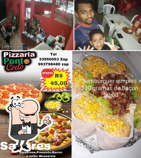 Confira a imagem mostrando interior e comida no Pizzaria Ponto Certo