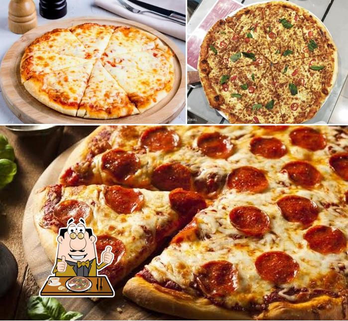 Try out pizza at PIZZA AND SANDWICH HUT