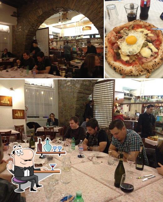 Among various things one can find interior and pizza at Pizzeria Vulcania