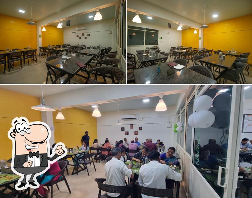 Take a seat at one of the tables at CLS VEG & NON VEG