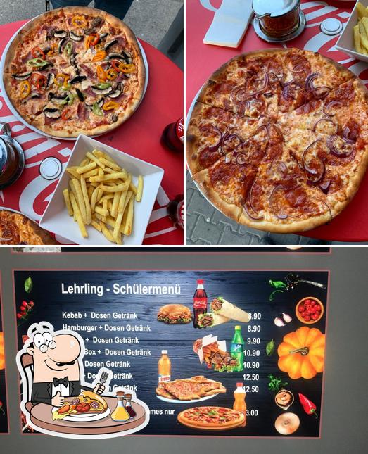 Get pizza at Deluxe Kebab Pizza