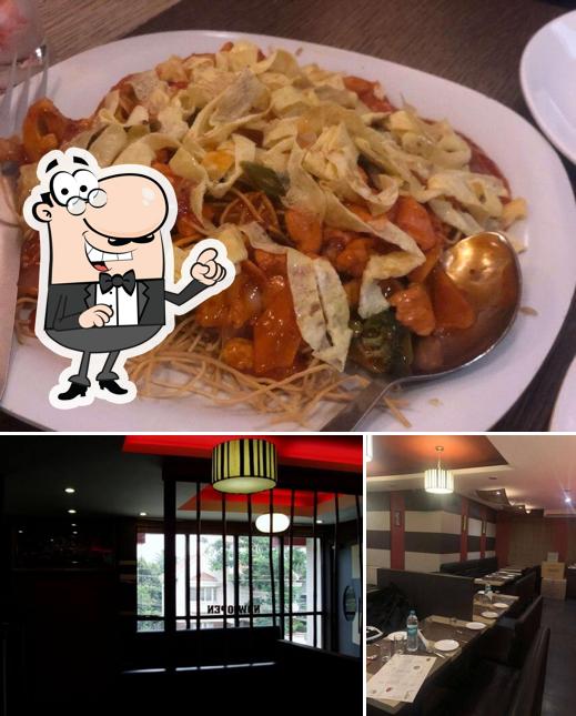 Take a seat at one of the tables at Beijing Bites - R T Nagar