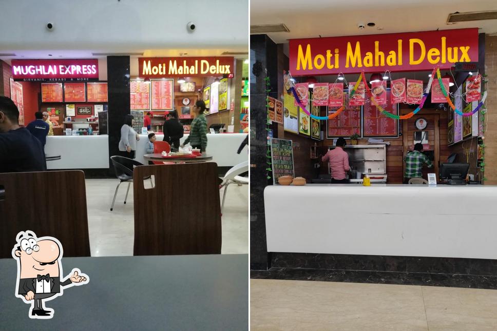 Take a seat at one of the tables at Moti Mahal Delux