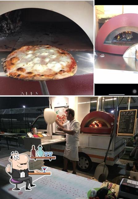 La immagine di interni e pizza da Al buongustaio On The Road
