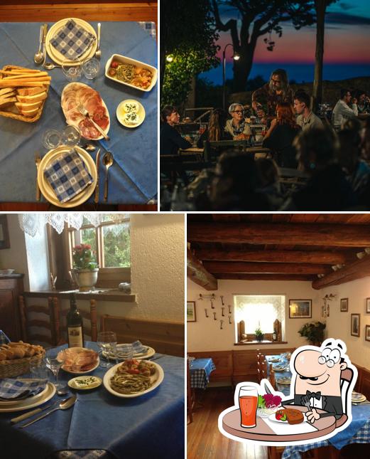 La foto della tavolo da pranzo e cibo di Ristoro La Roueige