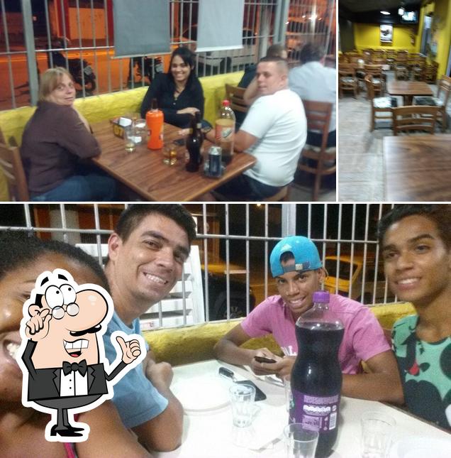 O interior do La Massita Rotisserie e Pizzaria