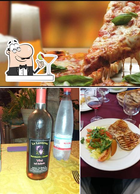 La Lanterna Ristorante - Pizzeria - Camere si caratterizza per la bevanda e tavolo da pranzo