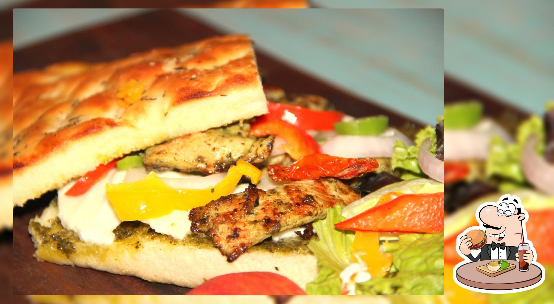 Order a burger at Pizza Mania