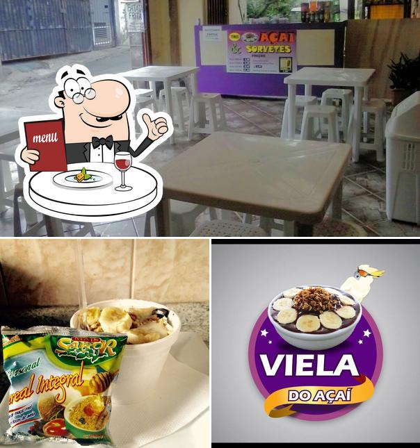 A ilustração do VIELA DO AÇAI’s comida e interior