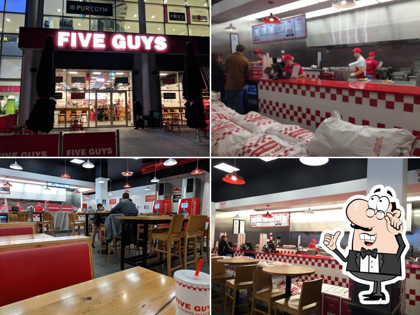 Take a seat at one of the tables at Five Guys Cambridge Leisure Park